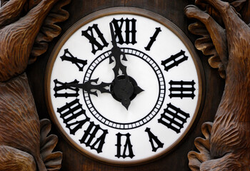 Fototapeta premium Old Wooden Clock Dial with hands at nine o'clock
