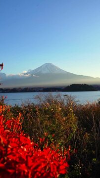 Mount Fuji with lake and red autumn leaves in Japan