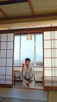 Relaxing in a traditional Japanese ryokan overlooking Mount Fuji