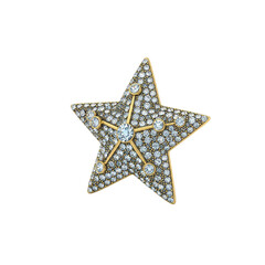 Obraz premium Gold star brooch with diamonds
