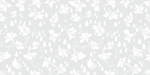 Seamless light gray floral pattern with soft scattered blossoms and leaves. Subtle elegant botanical design in gentle repeating layout. Minimal neutral background ideal for wallpaper, fabric .