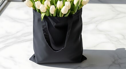 Elegant Black Tote Bag Overflowing with Fresh White Tulips on a Marble Surface.