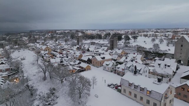 Visby City Wall Winter Aerial Pan Over Snow Covered Old Town Sweden