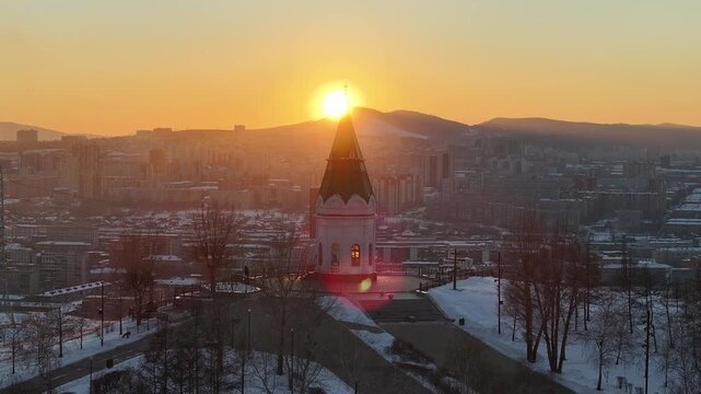Winter sunset in Krasnoyarsk. Paraskeva Pyatnitsa Chapel on Karaulnaya Mountain
