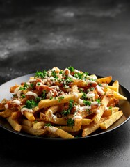 Delicious Loaded French Fries Topped with Savory Sauces and Fresh Herbs