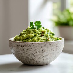 Freshly prepared vibrant guacamole in a rustic bowl, perfect for a healthy snack or dip