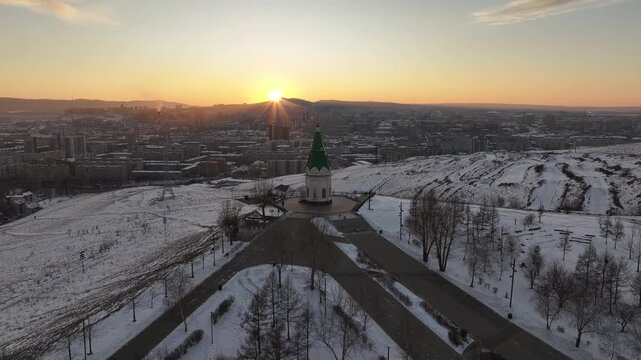 Winter sunset in Krasnoyarsk. Paraskeva Pyatnitsa Chapel on Karaulnaya Mountain