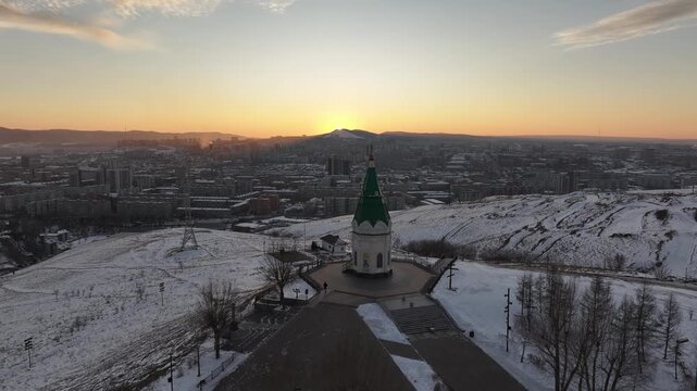 Winter sunset in Krasnoyarsk. Paraskeva Pyatnitsa Chapel on Karaulnaya Mountain