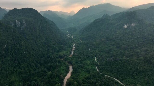 Beautiful Sunset in Nong Khiaw, a drone shot of picturesque Mountain Town on the Nam Ou River in Laos, Southeast Asia