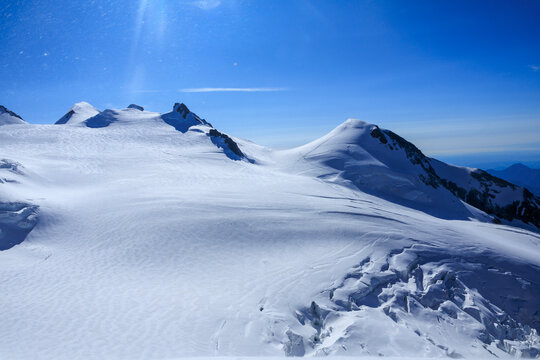 Mountain glacier panorama of Monte Rosa massif with summits Parrotspitze, Ludwigsh&ouml;he, Corno Nero (Schwarzhorn) and Vincent Pyramid (left to right) in Pennine Alps, Italy