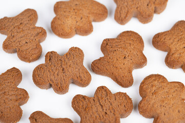 Sweet treats for afternoon relaxation. Imaginary coffee time with tasty snack bites. Little cookies on white plate bring to mind cozy coffee shop moments and restful pauses