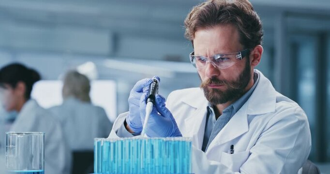 Scientist, research and man in lab, test tube for experiment and biotech for vaccine. Science, forensic analysis and person in workplace, medical info and study for pharmaceutical sample and cure