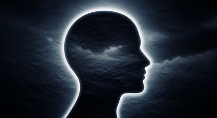 Obraz premium Silhouette of a persons head with a moon behind in a dark sky