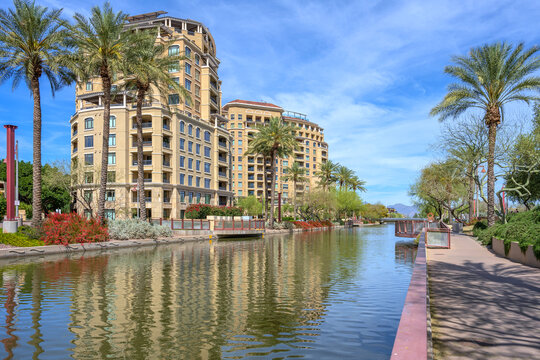 Modern buildings a canal and recreational area Scttsdale AZ.
