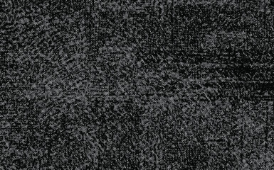 Fototapeta premium Dark grungy halftone texture background with distorted white dotted pattern on black background.