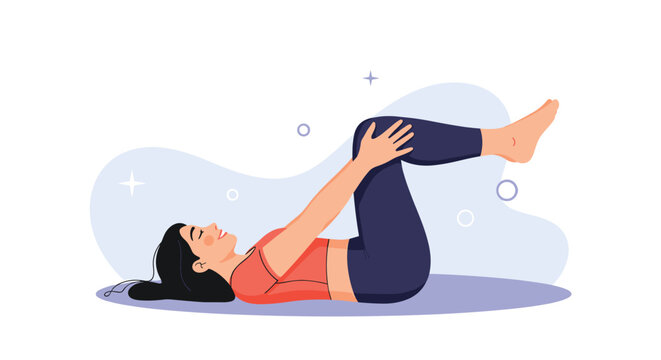 Young woman in sportswear lies on her back and pulls her knees to her chest during a relaxing exercise session.