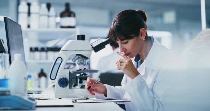 Science, exam and woman with microscope, lab or medical research for mRNA vaccine, think and biotech. Scientist, writing and innovation for HIV cure development, analysis and mature person with notes