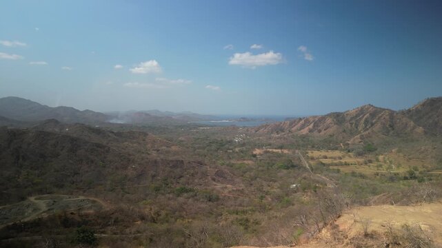 Aerial of dry hillsides with view of Pacific in Nuevo Colon Costa Rica Guanacaste Province