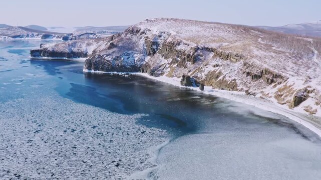 Coastal area of the Arctic Ocean in stunning 4K, showcasing icy waters, rugged shoreline, and vast northern landscape. Perfect for documentaries, climate content, travel films, and cinematic nature pr