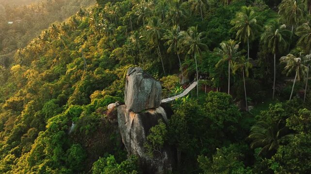 Overlap Stone in the jungle of Koh Samui, Thailand captured in stunning 4K, showcasing unique rock formation, lush greenery, and tropical landscape. Perfect for travel films, nature projects, and scen