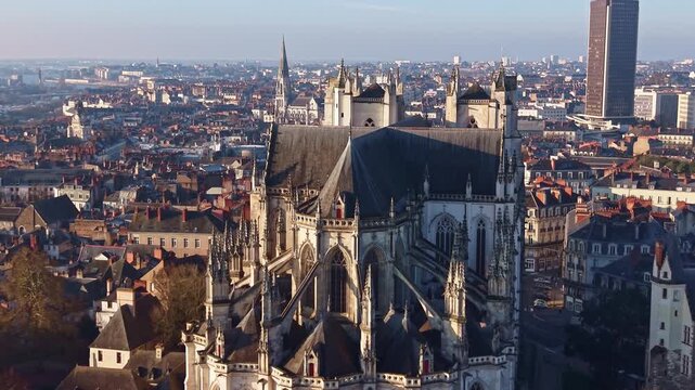 Cathedral of Saint Pierre or Saint Peter and Saint Paul in Nantes, France. Aerial drone backward, cityscape