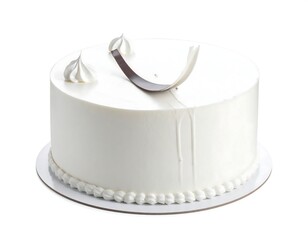 A smooth, white frosted cake with delicate chocolate curl and meringue decor on a corrugated cardboard cake board