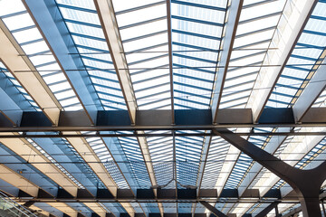 Fototapeta premium Modern glass roof structure with steel beams