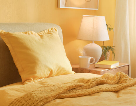Warm and inviting bedroom in golden hues.

