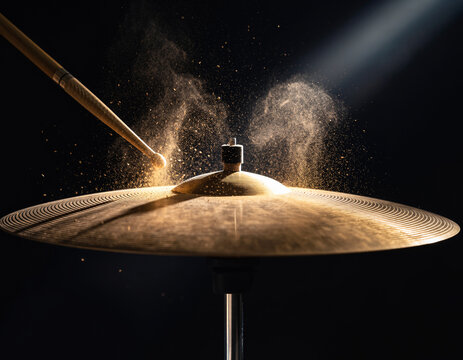 Golden Cymbal Vibrating After Impact with Flying Dust Particles