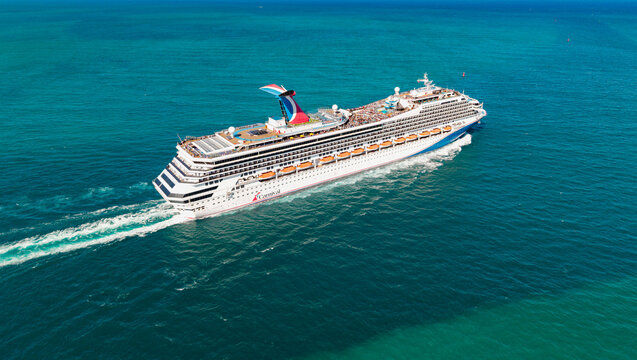 Miami, Florida, USA - March 21, 2025: Cruise in summer vacation. Carnival cruise line. Cruise ship travel. Ship leaving Miami beach port. Carnival Conquest cruise ship voyage. Traveling vacation