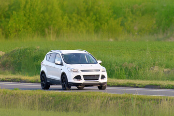 Fototapeta premium Driving a 4x4 SUV through green nature