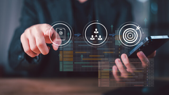 Project manager reviewing digital workflow dashboard with task checklist, team collaboration structure, and performance target tracking, emphasizing strategic execution and measurable business results