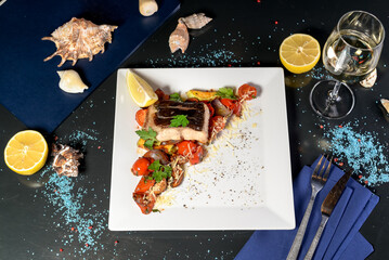 Gourmet Cooked Fish with Roasted Vegetables and Lemon