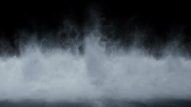 White and gray smoke, dense cloud and thick fog billow against dark black background. Abstract mist creates mysterious atmosphere. Dynamic movement with powerful white foam eruption captures raw