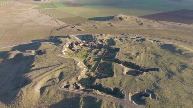 Cinematic aerial drone video of Gordion Ancient City near Polatli in Ankara, Turkey, showcasing the Midas Tumulus, ancient ruins, and wide historical landscape from above.