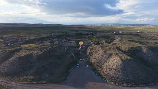 Cinematic aerial drone video of Gordion Ancient City near Polatli in Ankara, Turkey, showcasing the Midas Tumulus, ancient ruins, and wide historical landscape from above.