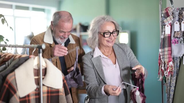 Elderly couple chooses lingerie or bra in a clothing store. High quality 4k footage