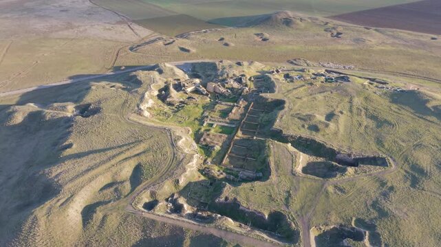 Cinematic aerial drone video of Gordion Ancient City near Polatli in Ankara, Turkey, showcasing the Midas Tumulus, ancient ruins, and wide historical landscape from above.
