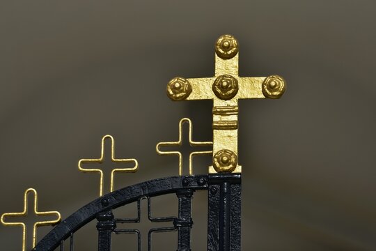 Traditional handcrafted wrought iron entrance gate with golden  religious symbols in Leonidio, Arcadia Peloponnese, Greece.