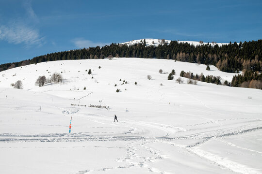 Cross-country ski trails and hiking trails on a snow-capped mountain