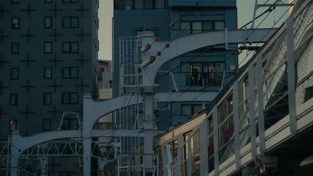Tokyo rail line passing over bridge near Asakusa waterfront.