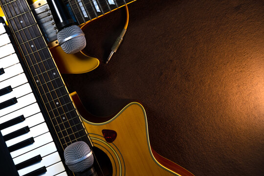 Music banner with acoustic guitar, electric guitar, piano keyboard and microphones with copy space. Band instruments composition background.