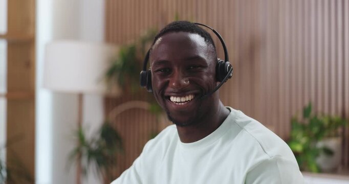 Face, black man and consultant in call center for telemarketing, smile and about us. Portrait, person and sales agent with headset for telesales, lead generation and pride for career in office