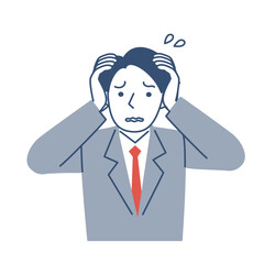 困った表情の男子学生の上半身