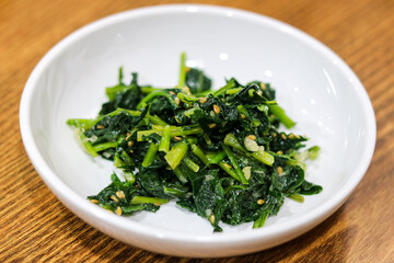 A classic and nutritious Korean side dish (banchan). This image features spinach (sigeumchi-namul). 