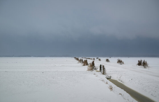Snow-covered polder landscape in winter at Eemnes Netherlands