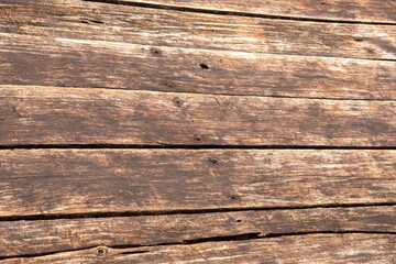 Fototapeta premium Closeup timber texture featuring metal elements. Rustic carpentry surface showing fastening points. Vintage plank arrangement with industrial accent. Brown natural flooring pattern for mockup