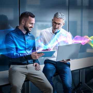 Business team analyzing data and collaborating with digital devices