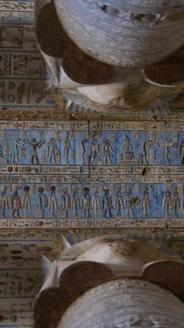 Dendera temple or Temple of Hathor. Painted columns with goddess faces and hieroglyphic ceiling of the hypostyle hall. Downscaled from 6k.