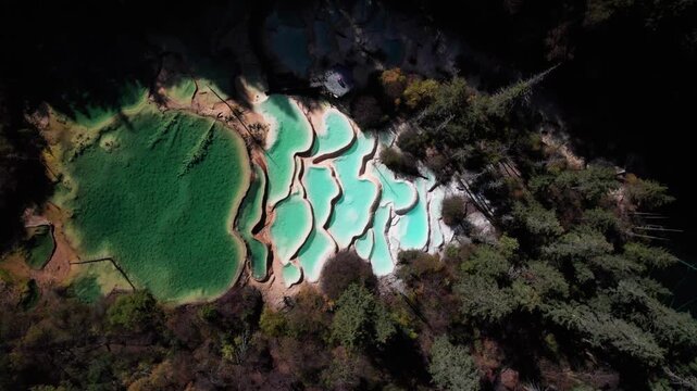 Drone view of Shenxianchi Scenic Area in Sichuan, China, near Jiuzhaigou and Huanglong, peaceful and clean water in pond among mountains, 4k real time footage travel concept.